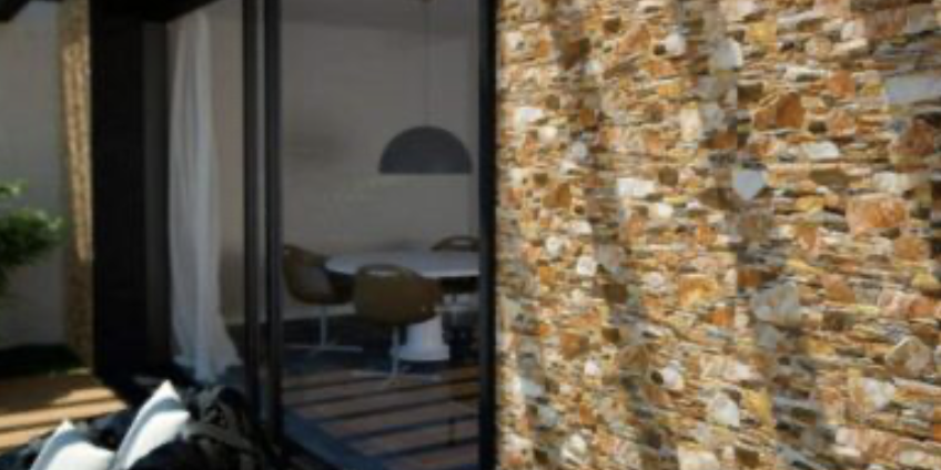 ¿Cómo revestir una pared exterior de piedra natural?